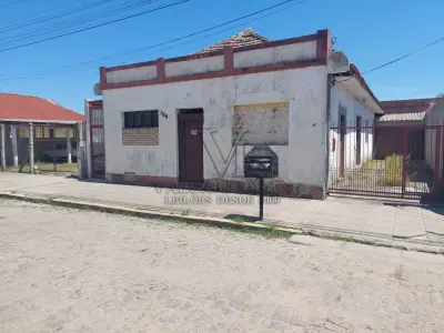 LOTE 456 - TERRENO com área superficial de 395,78m², situado na zona urbana desta cidade de Tapes/RS