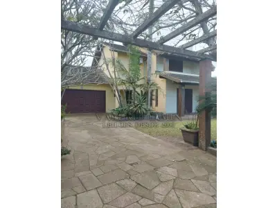 LOTE 600 - UM IMÓVEL RESIDENCIAL EM ALVENÁRIA COM AREA DE 196,77m² NA PRAIA CURUMIM EM CAPÃO DA CANOA.