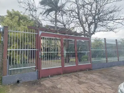 LOTE 600 - UM IMÓVEL RESIDENCIAL EM ALVENÁRIA COM AREA DE 196,77m² NA PRAIA CURUMIM EM CAPÃO DA CANOA.