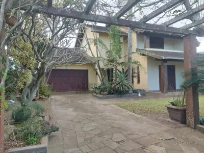 LOTE 600 - UM IMÓVEL RESIDENCIAL EM ALVENÁRIA COM AREA DE 196,77m² NA PRAIA CURUMIM EM CAPÃO DA CANOA.