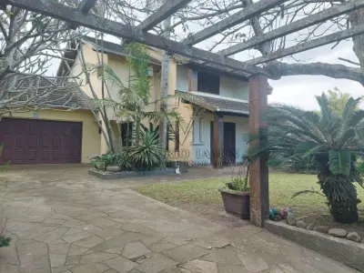 LOTE 600 - UM IMÓVEL RESIDENCIAL EM ALVENÁRIA COM AREA DE 196,77m² NA PRAIA CURUMIM EM CAPÃO DA CANOA.