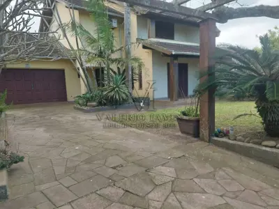 LOTE 600 - UM IMÓVEL RESIDENCIAL EM ALVENÁRIA COM AREA DE 196,77m² NA PRAIA CURUMIM EM CAPÃO DA CANOA.