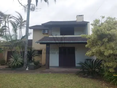 LOTE 600 - UM IMÓVEL RESIDENCIAL EM ALVENÁRIA COM AREA DE 196,77m² NA PRAIA CURUMIM EM CAPÃO DA CANOA.