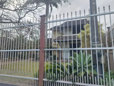 LOTE 600 - UM IMÓVEL RESIDENCIAL EM ALVENÁRIA COM AREA DE 196,77m² NA PRAIA CURUMIM EM CAPÃO DA CANOA.