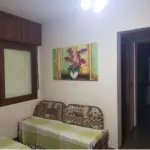 LOTE 130 - UM APARTAMENTO NA PRAIA ZONA NOVA DE CAPÃO DA CANOA